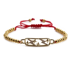 Bracciale regolabile con perline dorate, ciondolo a stella e cordino intrecciato rosso