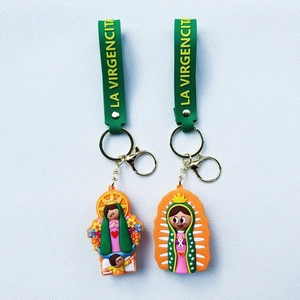 Cartoon La Virgencita keychain set with green rubber strap and golden metal ring