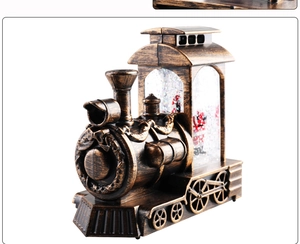Bronze vintage train snow globe featuring Santa Claus and interior glitter snowflakes