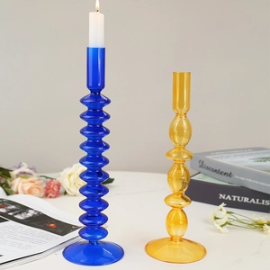 Vintage style glass candle holders in blue wave and yellow gourd designs for home decor