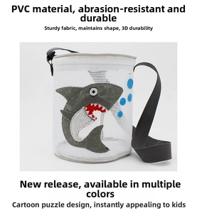 Detail of durable white mesh children beach bag with a 3D shark patch and PVC material