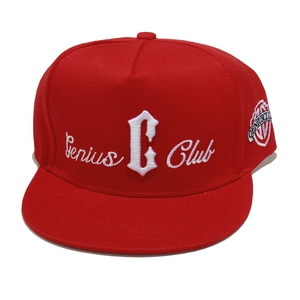 Detail shot of 3D embroidery and fabric texture on a red hip-hop flat brim baseball cap