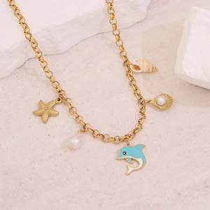 Detailed view of gold stainless steel necklace with starfish, pearl and blue dolphin charms