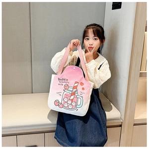 Close-up of pink canvas tote bag featuring cute strawberry milk cartoon illustration