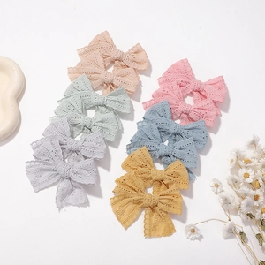 Pastel lace bow hair clips set for babies featuring hollow embroidery in multiple colors