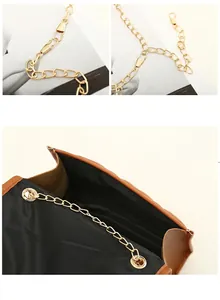 Detail view of adjustable gold chain strap and spacious interior of the brown leather bag