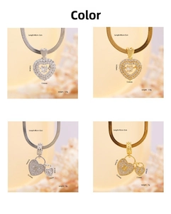 Detail of copper heart pendant necklaces with cubic zirconia in gold and silver finishes
