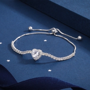 Macro detail of adjustable silver S925 bracelet with heart zircon and pavé setting