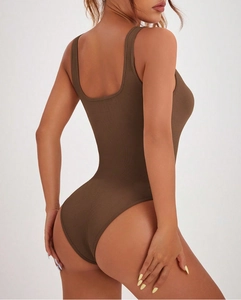 Close-up of seamless backless dark brown bodysuit with high-stretch ribbed fabric texture