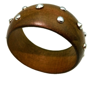 Retro wide wood bangle with silver metal studs and punk style design on white background