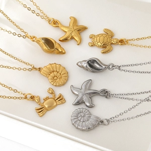 Gold and silver ocean necklaces with starfish, shell, and crab pendants for women
