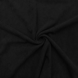 Macro texture view of black ribbed polo shirt fabric with spiral folded texture pattern
