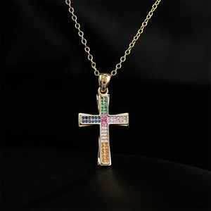 18K gold plated cross necklace featuring vibrant multi-color zircon stones on dark background