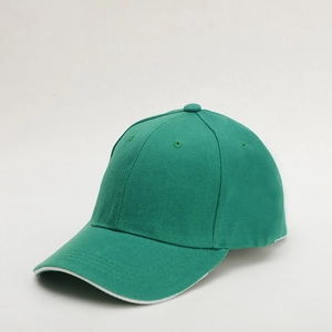 Detailed close-up of green cotton baseball cap with white brim edge and eyelets