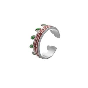 Detail of adjustable silver ring with green leaf and red wave enamel pattern
