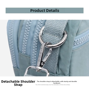 Detail of teal crossbody bag showing silver BOBO logo buckle and durable fabric texture
