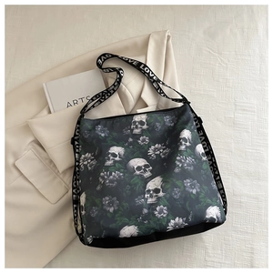 Detail of nylon crossbody bag featuring skull and floral prints with LOVE straps