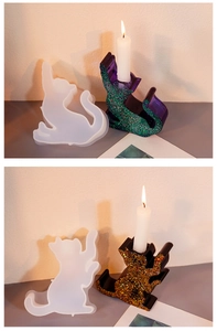 Detail view of cat-shaped silicone molds for resin casting and finished glitter candle holders