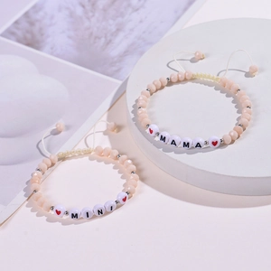 Detail of MAMA and MINI beaded bracelets with faceted crystals and adjustable nylon cords