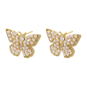 Detail of 18K gold butterfly earrings with micro-set pearls and sparkling rhinestones