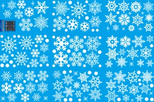 Detailed pattern of white snowflake window stickers on a bright blue backing paper