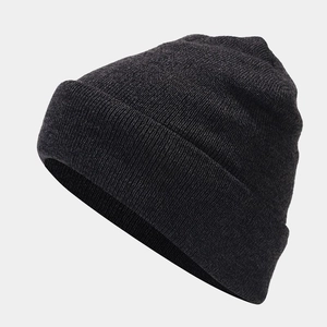 Detailed side view of charcoal grey knit beanie with warm fleece lining and textured stitch