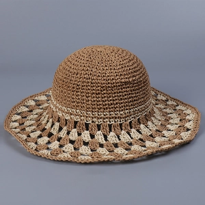 Handmade crochet sun hat with wide brim in bohemian straw style for women's beach vacations