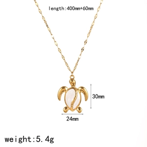 Macro view of gold sea turtle pendant with dimensions and weight specifications