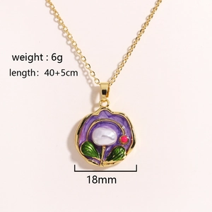 Detail of elegant gold necklace featuring purple enamel flower and white freshwater pearl