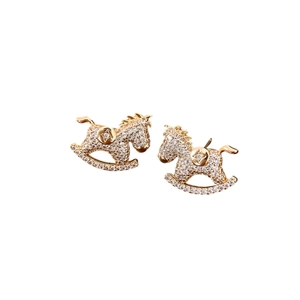 Cute golden horse stud earrings with white zircon stones on a white background