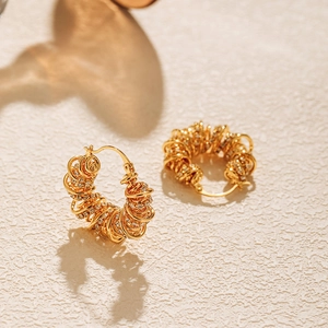 Gold-plated twisted wire hoop earrings with zircon pavé setting for a trendy look