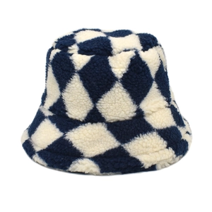 Detail of blue and white checkered lamb wool bucket hat with soft plush texture