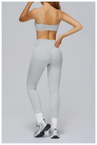 Detail view of heathered grey yoga set featuring racerback bra and high-waist leggings