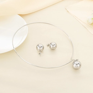 Detailed view of silver hollow sphere jewelry set featuring a choker and stud earrings