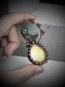 Detailed handmade copper wire wrapped pendant with labradorite moon and star design