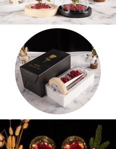 Detail view of red preserved roses in glass dome with LED wood base and gift box