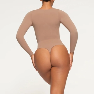 Back view of a nude long-sleeved bodysuit featuring a round neck and thong-style bottom