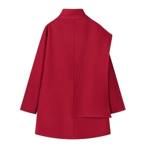Detail of red wool coat showing standing collar and unique asymmetric layered overlay