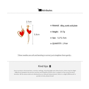 Detailed size and weight chart for gold-finish asymmetric red heart earrings
