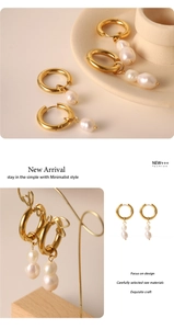 Macro detail of French vintage 18k gold hoop earrings with irregular baroque pearls