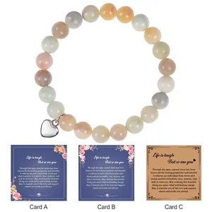 Detail of 8mm natural stone bead bracelet with heart charm and healing greeting cards