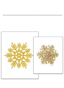 Detailed view of 3D snowflake brooch with sparkling rhinestones and gold plating