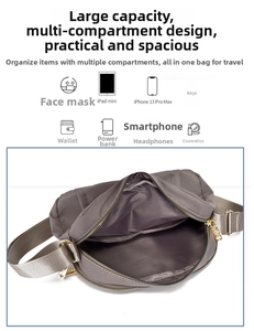 Detail view of the nylon crossbody bag showing multiple inner compartments and organized storage