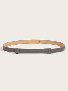 Detailed close-up of dark grey Saffiano leather belt with silver rivets and dual loops