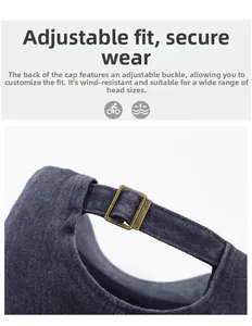 Detail of adjustable bronze metal buckle on vintage washed dark gray baseball cap