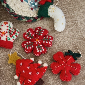 Handmade wool felt Christmas ornaments set including tree, snowflake, glove, and stocking