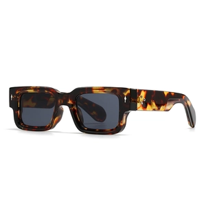 Classic tortoise shell square sunglasses with dark lenses and silver metal rivet accents
