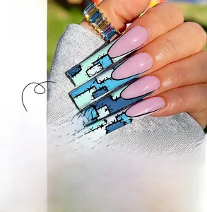 Detailed view of long French ballerina press-on nails in purple and blue stitch pattern
