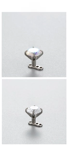 Detail of 6mm zircon dermal anchor in G23 titanium with four-prong setting and base