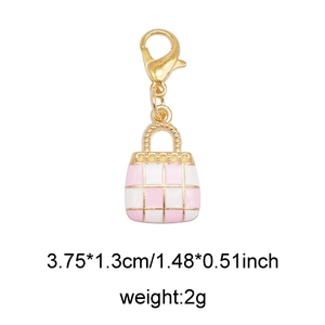 Detail of pink checkerboard purse charm with golden lobster clasp and size info